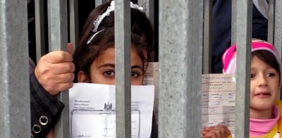 Zionist Jews put Palestinian children in cages like animals.